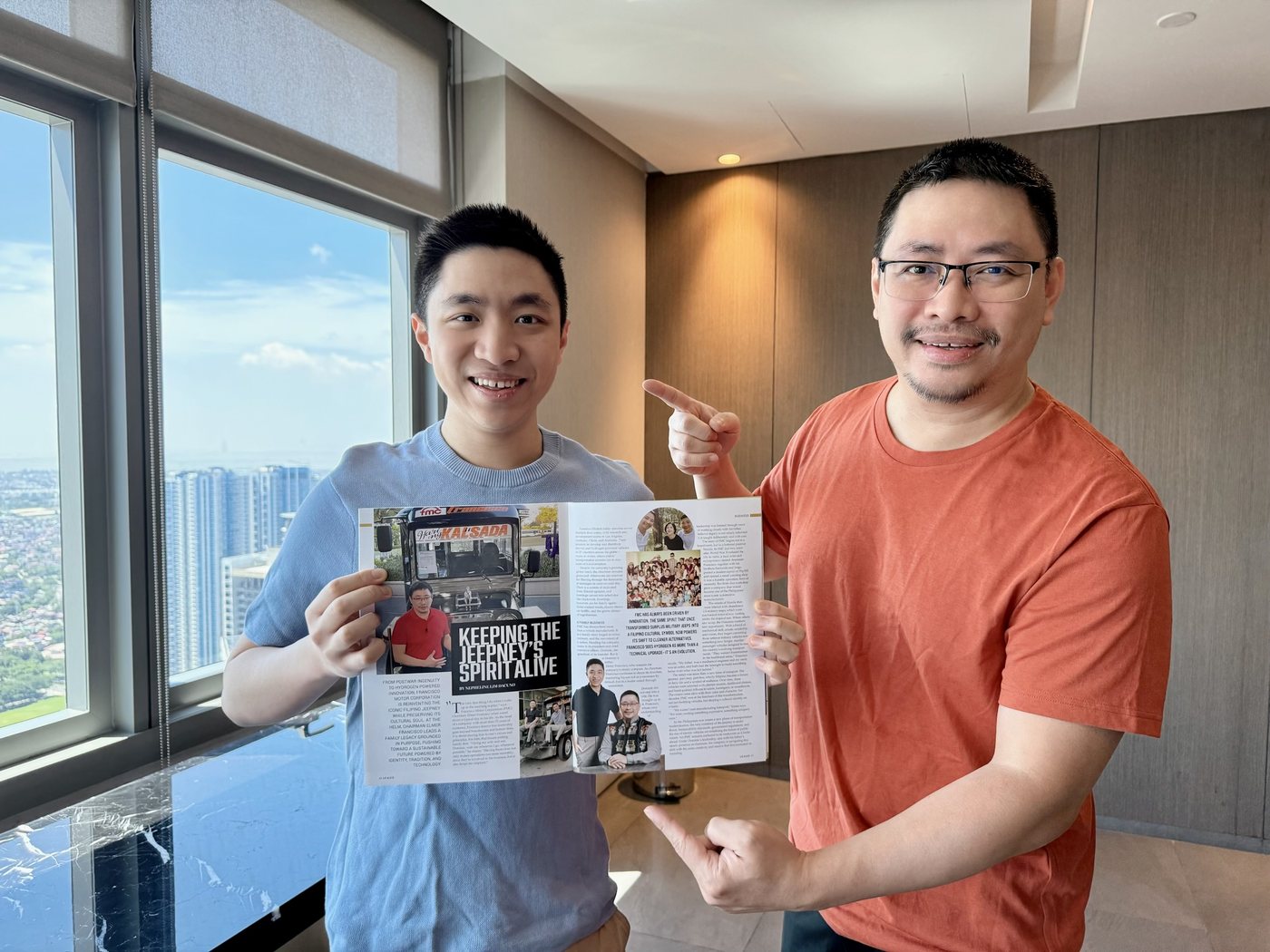 Elmer Francisco holding a magazine feature on the Francisco jeepney